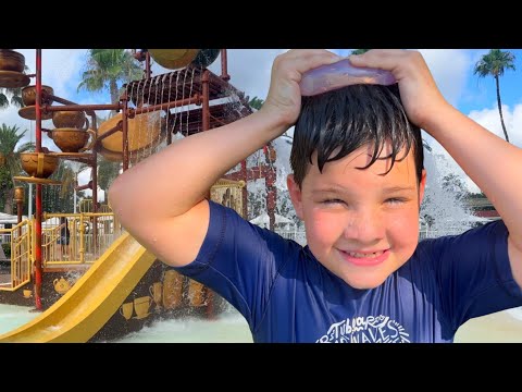 BEST SPLASH PAD PLAYGROUND EVER! Caleb PLAYS in the WATER SLIDE with MOM & DAD! Splash Pad for Kids!