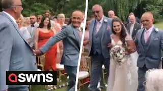 Dad stops wedding to grab bride's stepdad so they could BOTH walk her down the aisle | SWNS