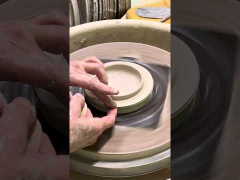 Wheel throwing a lid for a pottery jar. (Sound on for details)