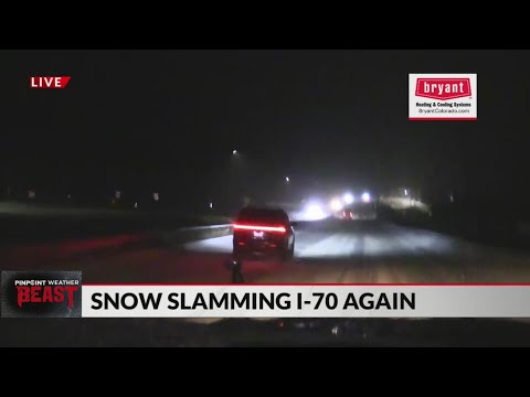 Drivers traveling despite heavy snow fall in Colorado