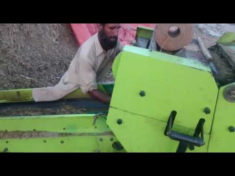 Corn stalk silage baler working