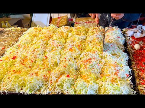 japanese street food - busy okonomiyaki stall お好み焼き