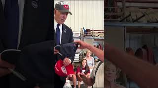 Joe Biden swaps hats with Trump supporter