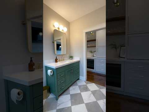 Before and after laundry room / bathroom facelift with new checkered floors & green vanity cabinets!