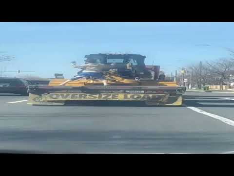 Dancing Crazy Lady Jumps Off Moving Wide Load Trailer