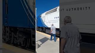 Utah Transit Authority Front Runner Train Crew Climbs Down from the Locomotive Cab at Provo Utah