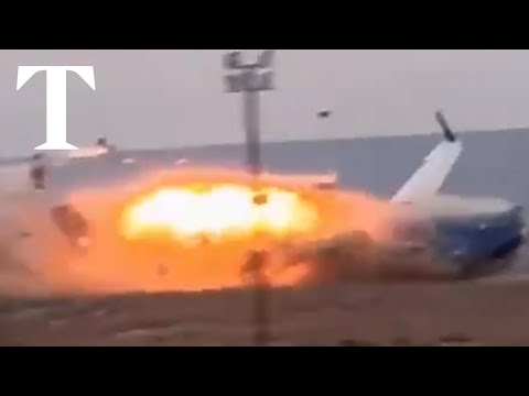 Moment plane crash lands in Kazakhstan