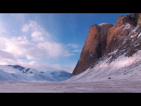 Skiing towards a gigantic rock wall - Akshayuk Pass 2008 expedition