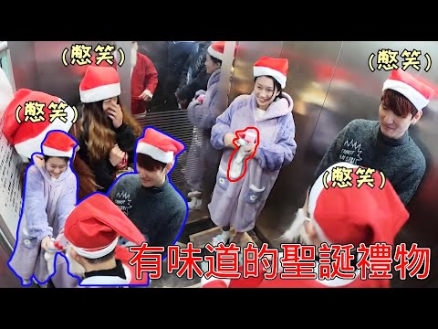 Laughing elevator prank! The cute girl met Santa Claus in the elevator handing out gifts. She turne