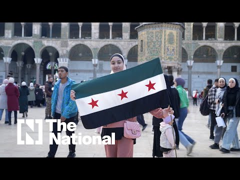 Syrians attend the first Friday prayer after the fall of Assad