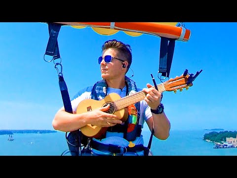 Singing "Somewhere Over The Rainbow" while Parasailing