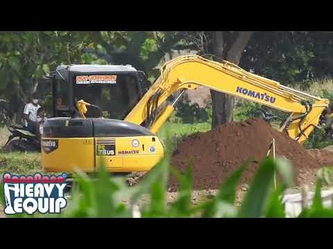 mini komatsu 78US Digging dirt on a toll road project