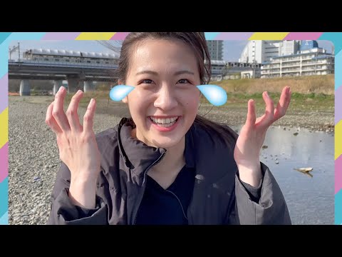 Our science lady is exploring a river, looking at stones and trying to catch fish