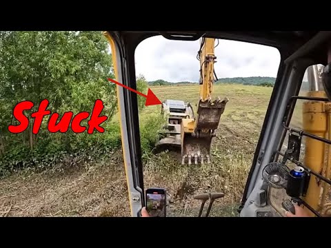 Case 140 Excavator put to the test cutting some crazy Brush because Aaron is stuck in the mud!