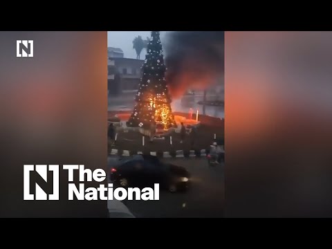 Protests erupt in Damascus over burning of Christmas tree