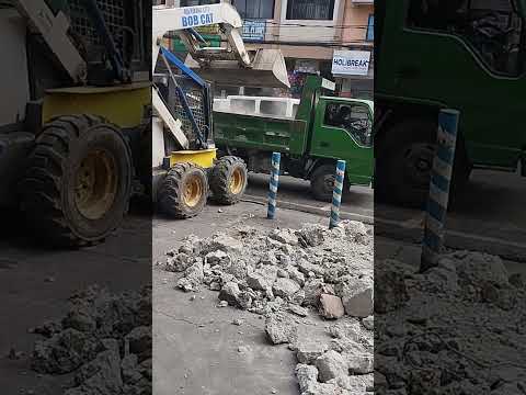 Skid steer bobcat loading crumbles