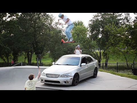 Jumping Over A Car Parked In The Skatepark