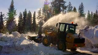 Cat® 906 Next Generation Compact Wheel Loader Removing Snow