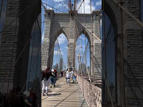 View of the Manhattan skyline and the Manhattan Bridge, from the iconic Brooklyn Bridge in NYC!”