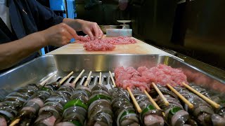 The long-established eel restaurant "UNATETSU"  in Tokyo.The preparation of grilled Eel skewers.