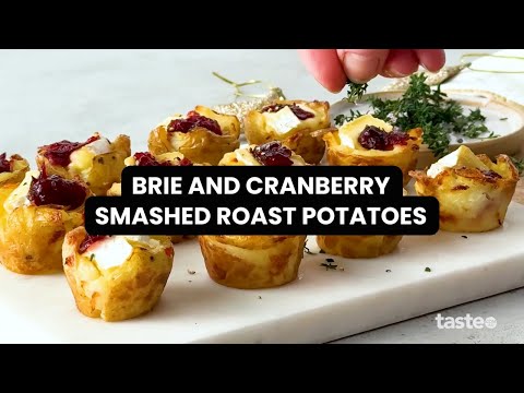 Deliciously festive smashed roast potatoes with brie and cranberry - perfect for Christmas parties!