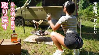 A woman enjoys roasting sausages over a campfire alone!