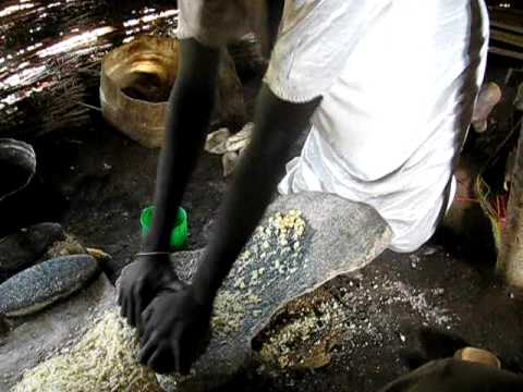 Grinding Corn (aka Maize) to For Ugali