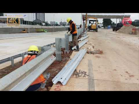 STAGES OF INSTALLING ROAD GUARDRAILS WITH A PILE DRIVER