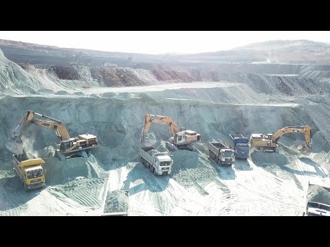 Caterpillar And Liebherr Excavators Loading Trucks On The Line - Aerial Video - Ascon Ltd