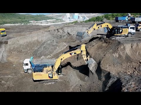 Caterpillar 385C And Caterpillar 352F Excavators Loading Trucks - Aerial Video - Ascon Ltd