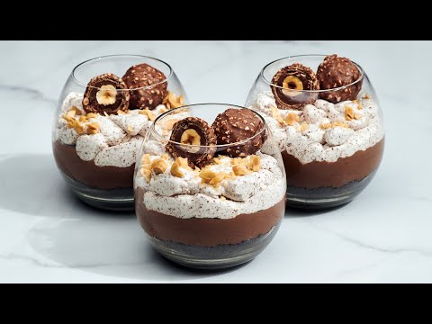 Amazing chocolate and nuts dessert Ferrero Rocher in cups.