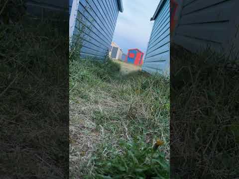 Wild camp with no tent a sleeping bag and Matt between beach huts on Hayling island beach uk