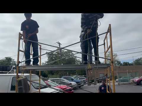 Students learn how to hoist objects from a scaffold. Part 1