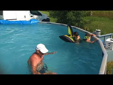 Lucy and Jack's first day swimming without floaties