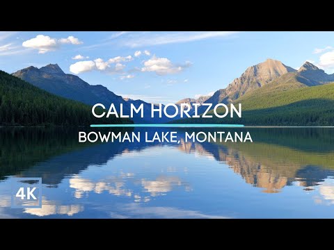 Peaceful Lake Waves and the Stunning Scenery of the Mountains of Glacier National Park in 4K UHD