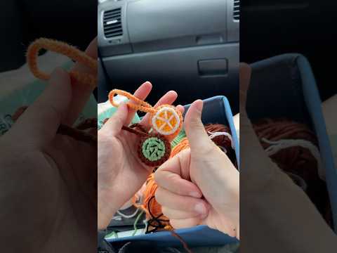 Crochet airtag cover in car 😈 #crochet #crochetcover #crochetairtag #crochetairtagkeychain