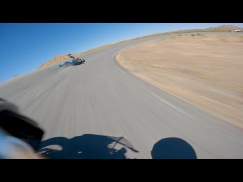 Chasing motorcycle instructor on track