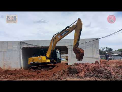 Backfilling Activity! Excavator and Truck on road Construction