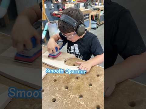 A kid and his sander. #diycrafts #sanding #woodshop