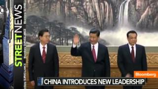 China Unveils New Leadership, Reduces Politburo