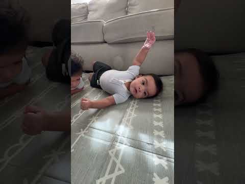 Twin babies doing tummy time ￼