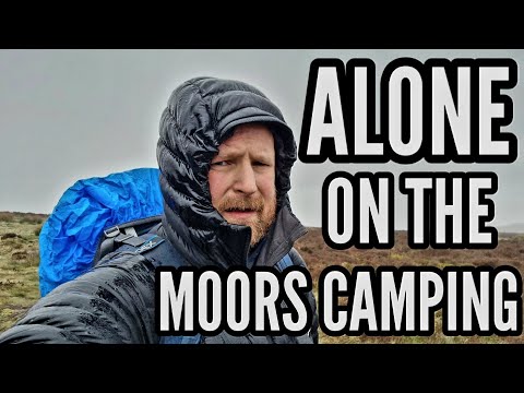 Solo Tent camping in Moorland woodland after a long day hiking.