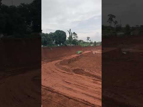 TRUCKS PASS IN THE DEEPEST EXCAVATION