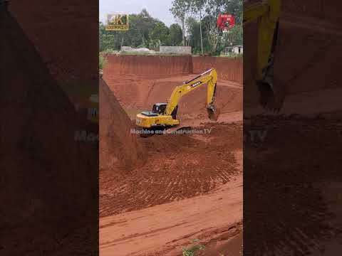 SANY SY215C EXCAVATOR IS DIGGING THE GROUND ON THE HILL