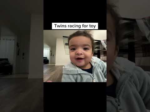 Twin babies racing for toy ￼