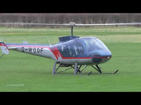 G-WOOF an Enstrom Helicopter makes a  precautionary landing