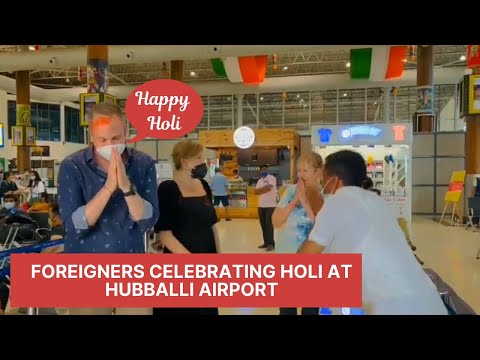 Foreigners celebrating Holi in Hubballi Airport