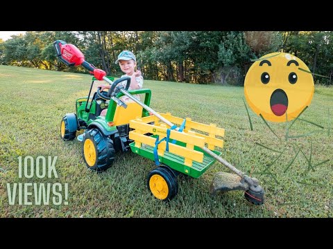 Mowing with his Tractor!!