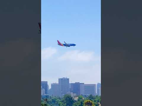 Airplane flying  over downtown San Diego California