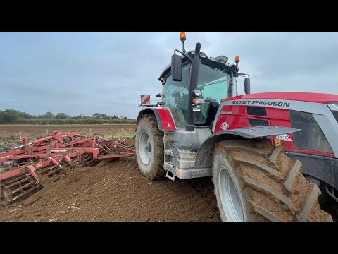 Bulldozing and levelling soil with a self steering tractor